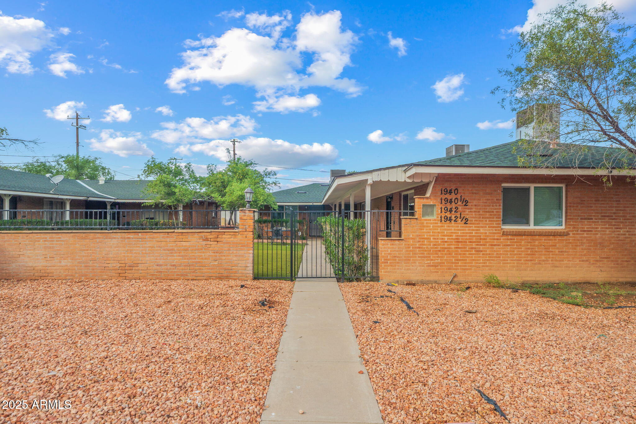 1940 West Amelia Avenue, Unit 1940 Phoenix, AZ 85015 - Photo 1 of 17 a view of a backyard of the house