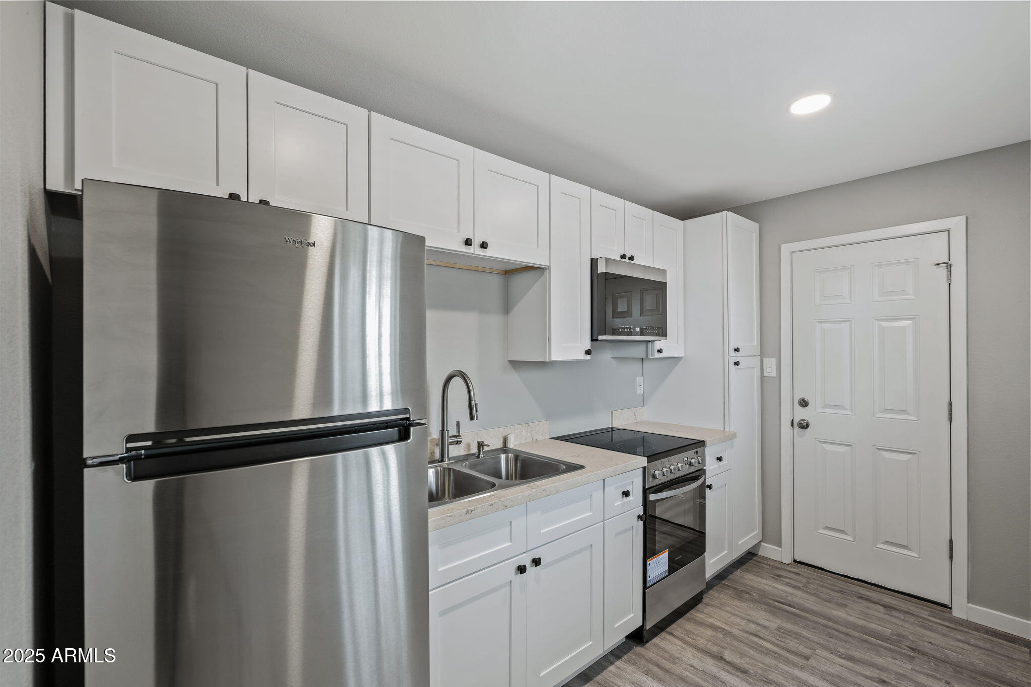 1940 West Amelia Avenue, Unit 1940 Phoenix, AZ 85015 - Photo 11 of 17 a kitchen with a refrigerator stove and sink