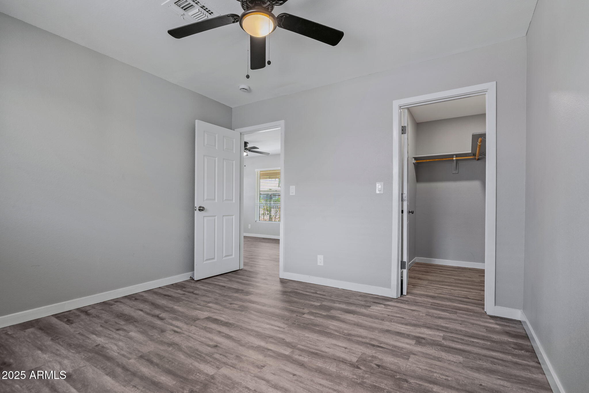 1940 West Amelia Avenue, Unit 1940 Phoenix, AZ 85015 - Photo 14 of 17 wooden floor in an empty room