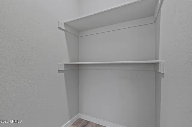 a view of an empty walk in closet