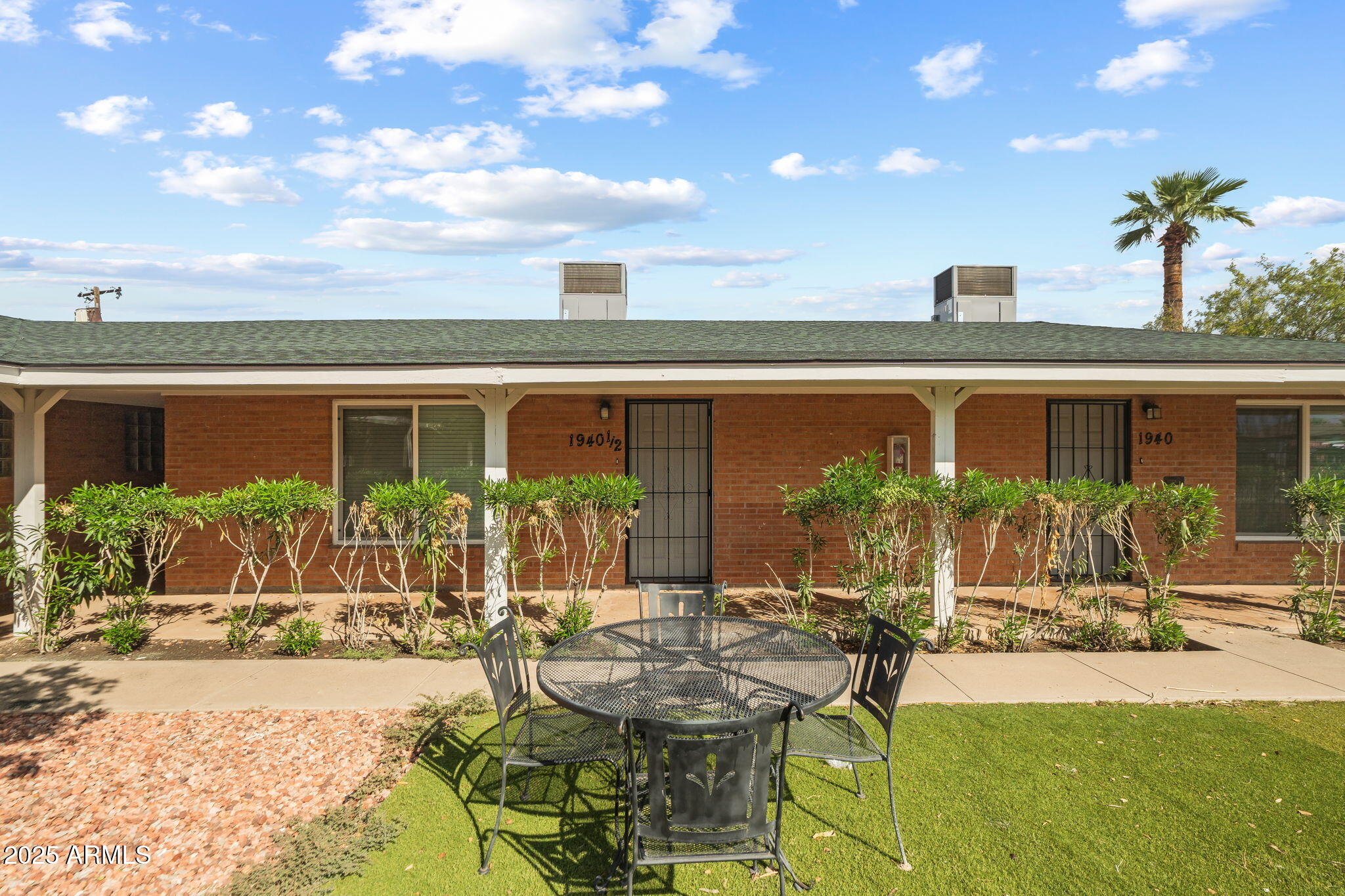1940 West Amelia Avenue, Unit 1940 Phoenix, AZ 85015 - Photo 3 of 17 a view of an house with backyard and sitting area