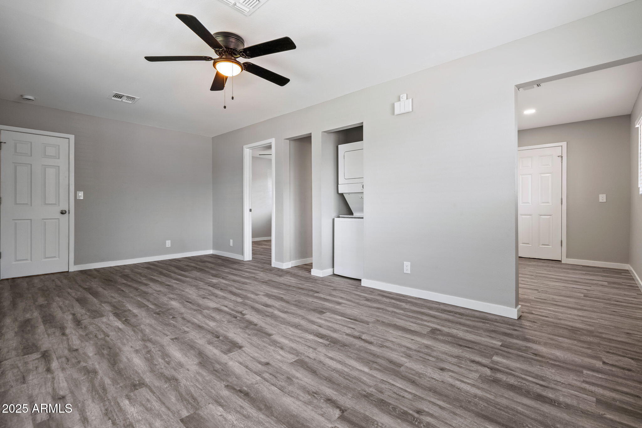 1940 West Amelia Avenue, Unit 1940 Phoenix, AZ 85015 - Photo 8 of 17 a view of empty room with wooden floor
