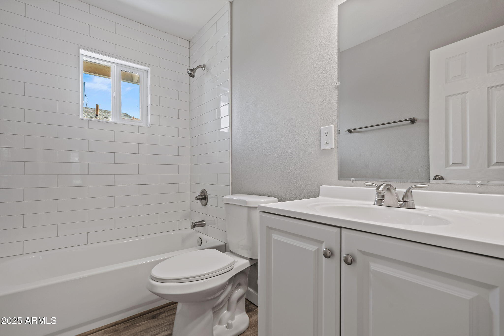 1940 West Amelia Avenue, Unit 1940 Phoenix, AZ 85015 - Photo 9 of 17 a bathroom with a sink toilet and shower