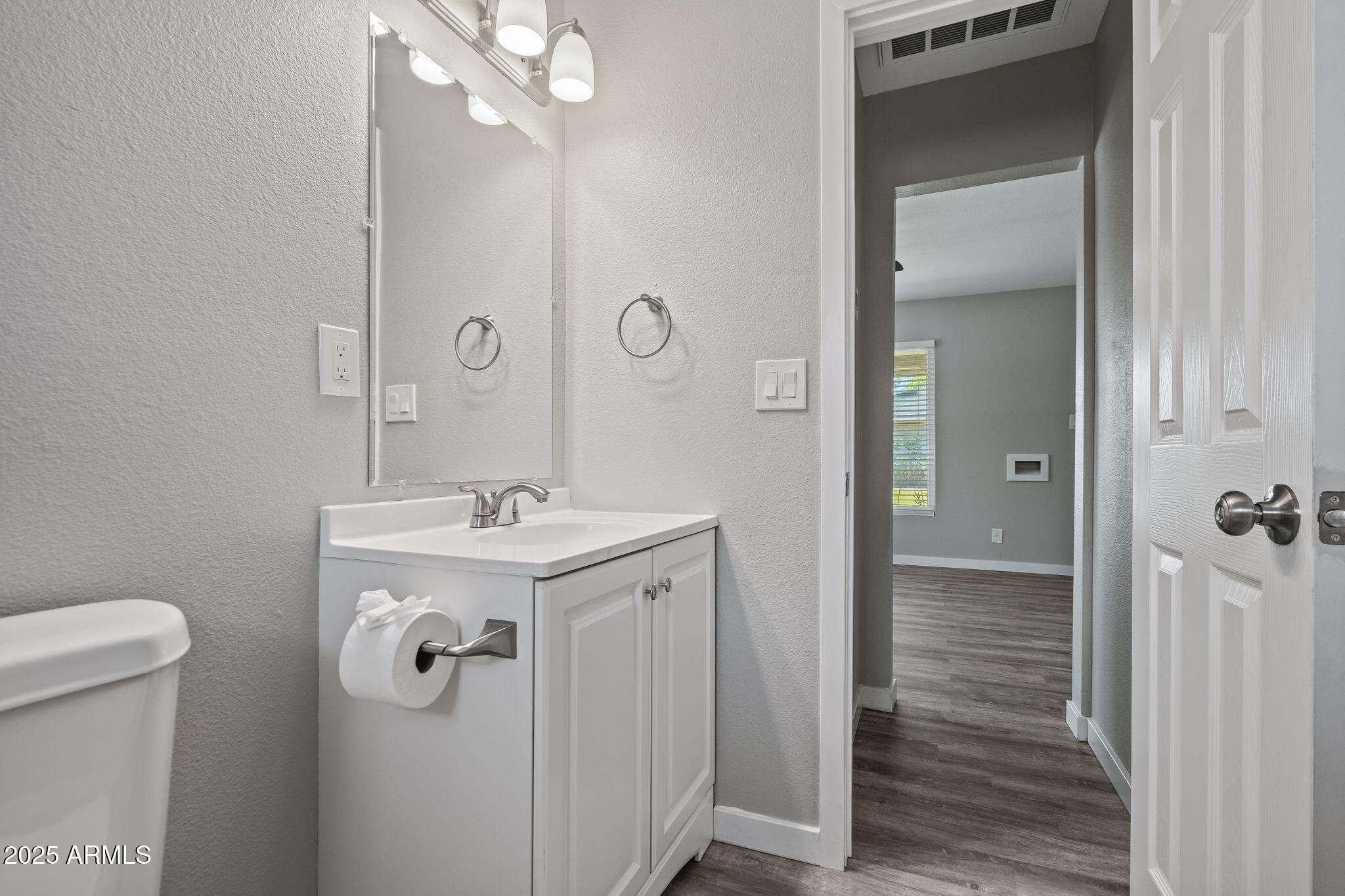 1940 West Amelia Avenue, Unit 1940 Phoenix, AZ 85015 - Photo 10 of 17 a bathroom with a sink a toilet and shower