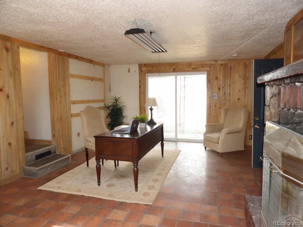 1002 Frontier Street Pueblo, CO 81006 - Photo 12 of 26 a living room with furniture and a window