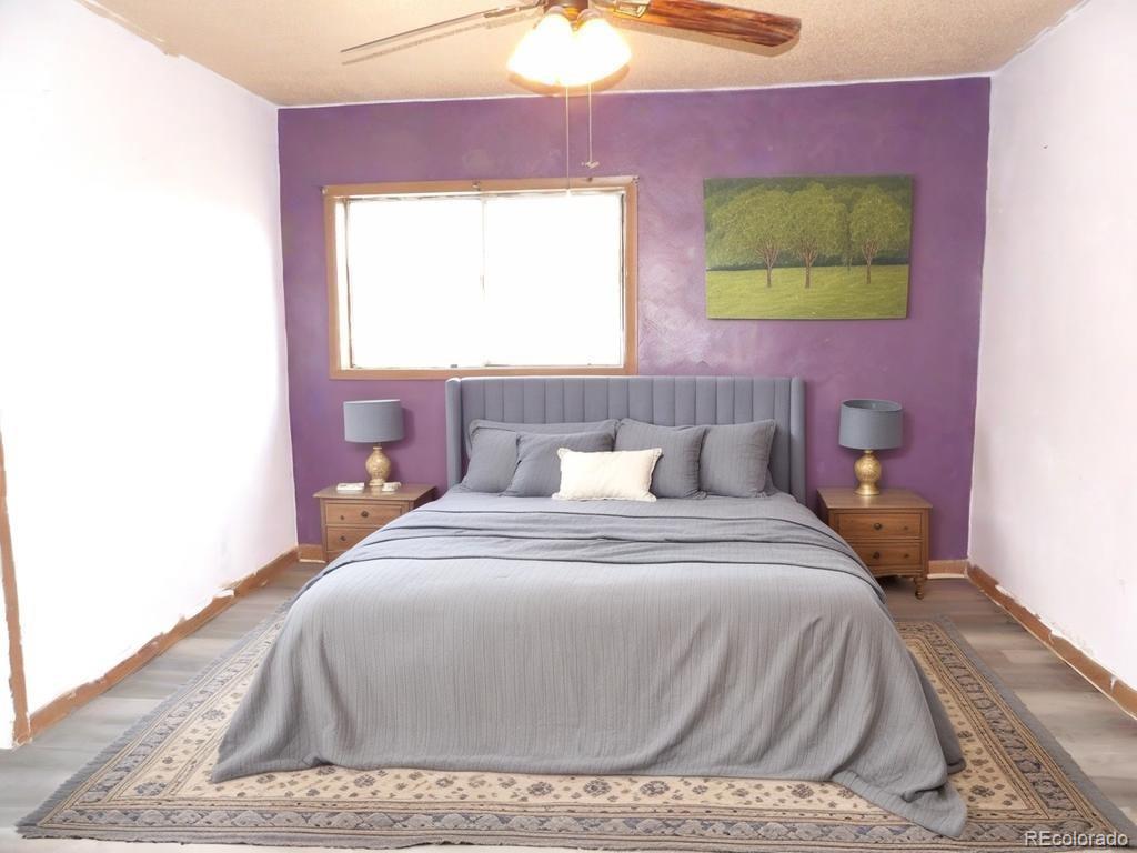 1002 Frontier Street Pueblo, CO 81006 - Photo 8 of 26 a bedroom with a bed and a window