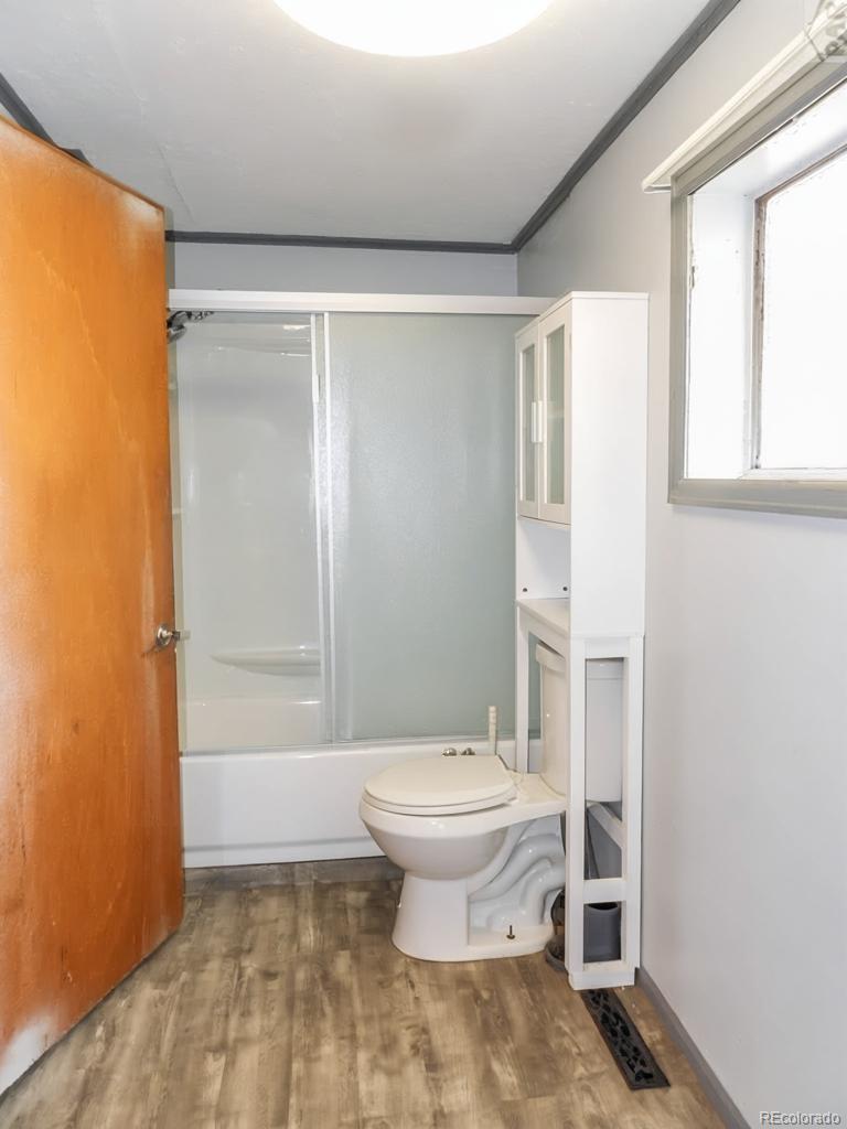 1002 Frontier Street Pueblo, CO 81006 - Photo 10 of 26 a bathroom with a sink toilet and shower