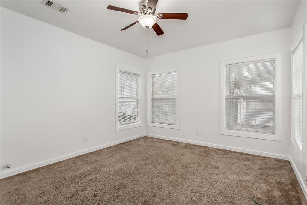 7414 Robin Road Dallas, TX 75209 - Photo 23 of 31 an empty room with windows and fan