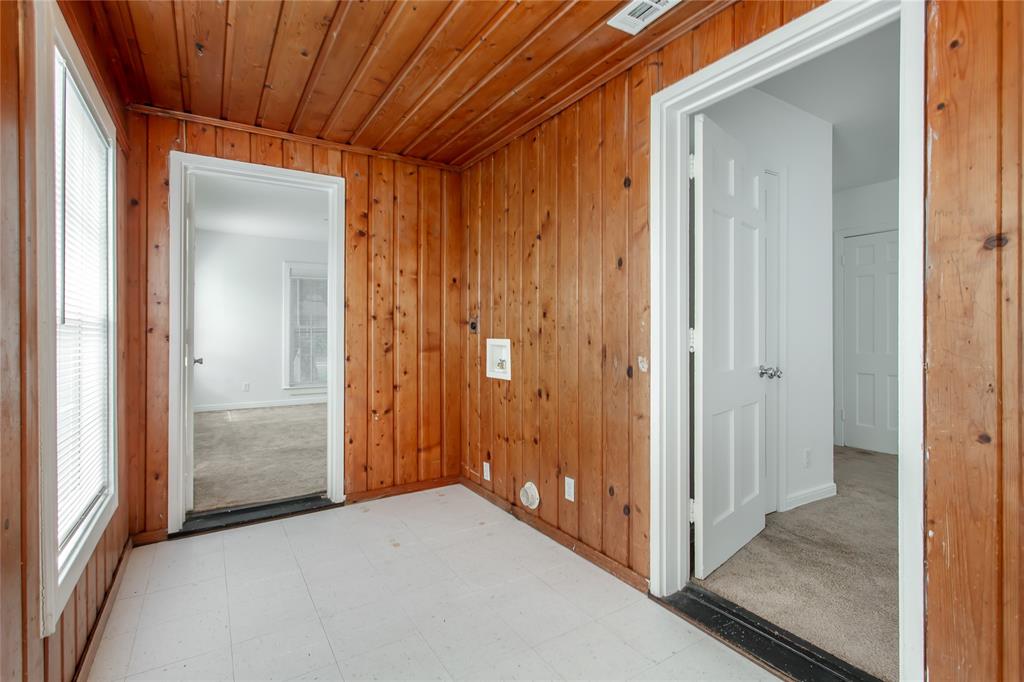 7414 Robin Road Dallas, TX 75209 - Photo 24 of 31 a view of a hallway with wooden shelves
