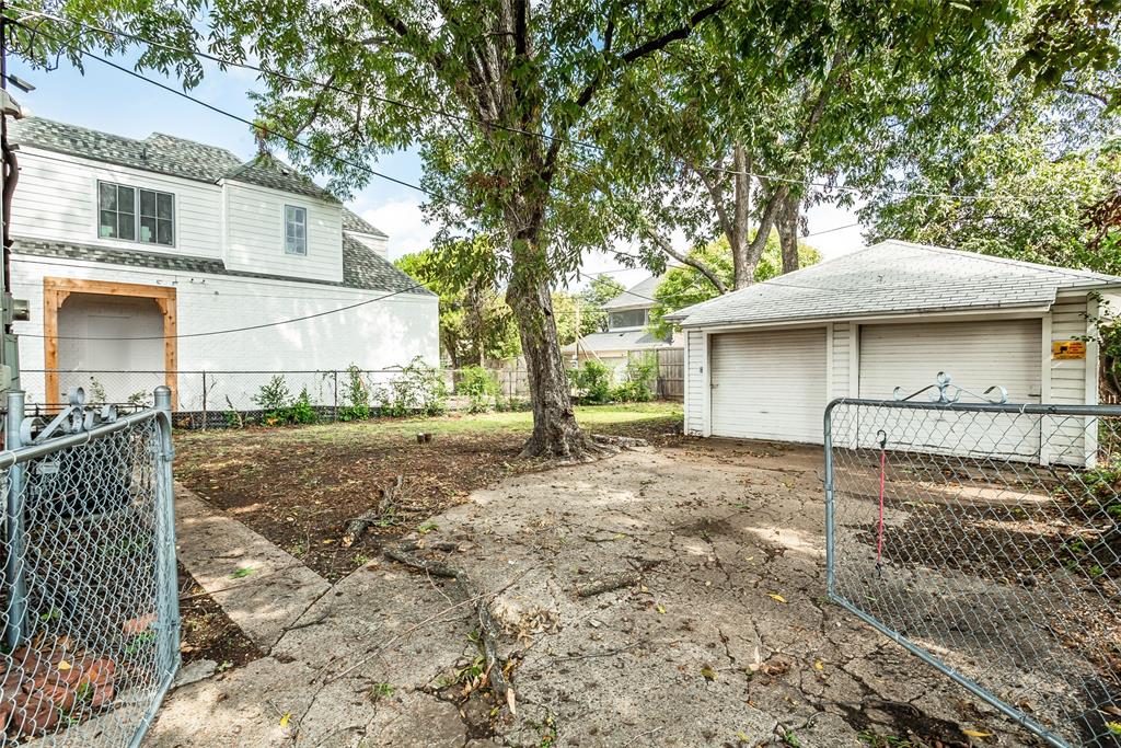 7414 Robin Road Dallas, TX 75209 - Photo 28 of 31 a view of a house with a yard