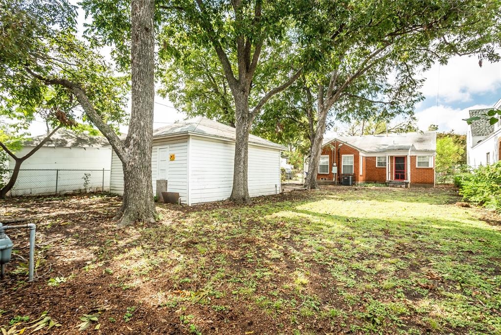 7414 Robin Road Dallas, TX 75209 - Photo 30 of 31 a front view of a house with a garden
