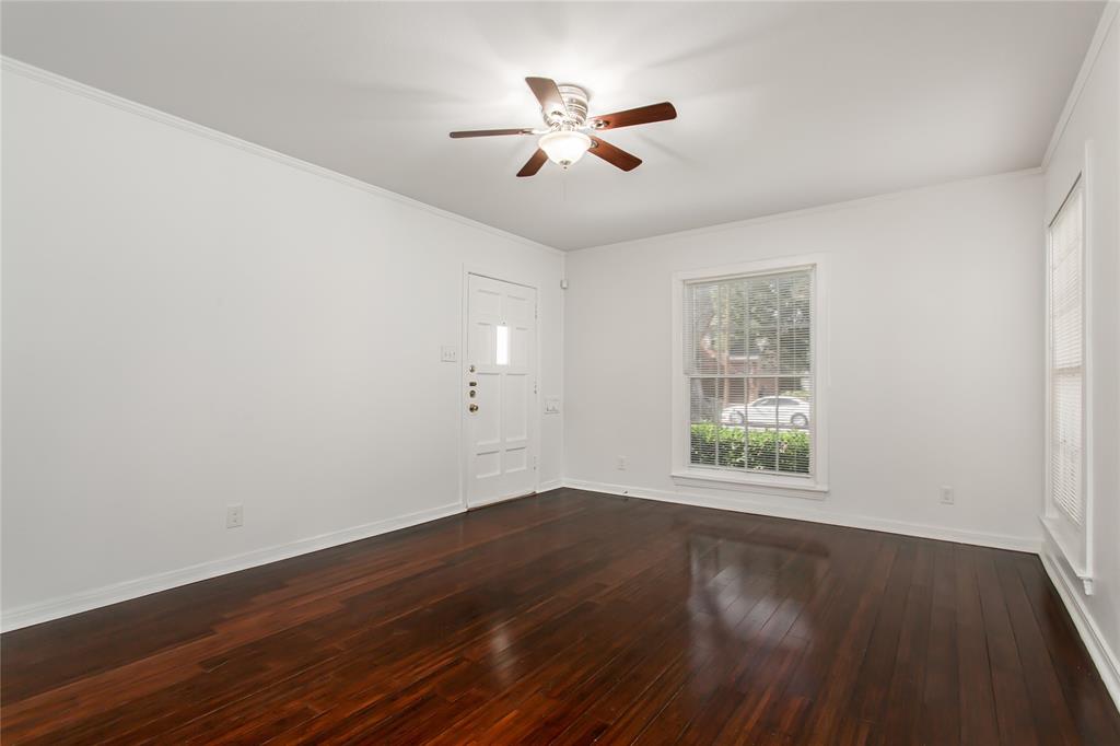 7414 Robin Road Dallas, TX 75209 - Photo 9 of 31 wooden floor in an empty room with a window