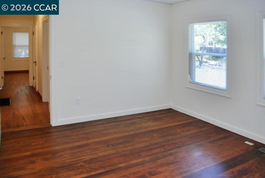 2652 Reliez Valley Road Martinez, CA 94553 - Photo 15 of 34 a view of an empty room with wooden floor and a window