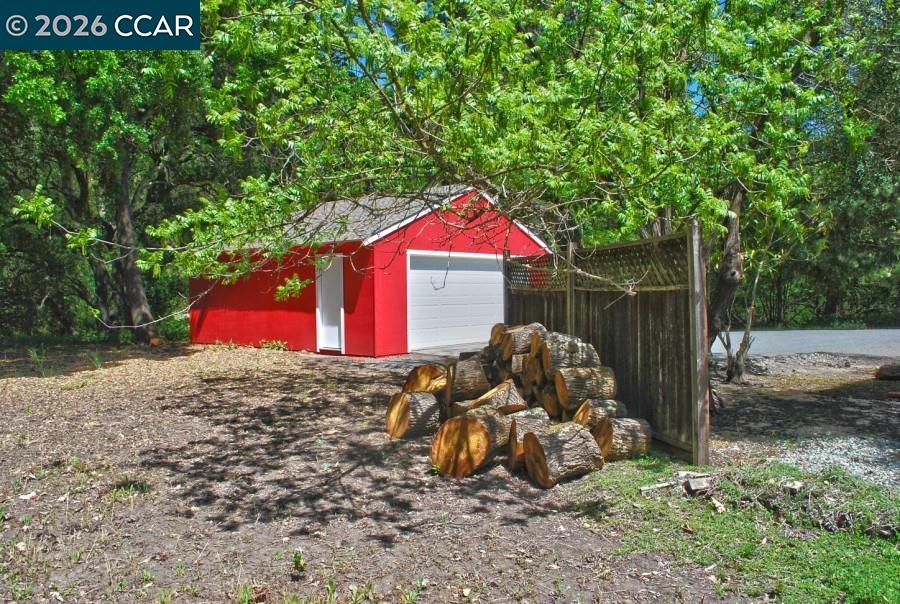 2652 Reliez Valley Road Martinez, CA 94553 - Photo 22 of 34 a view of backyard with wooden fence and large trees