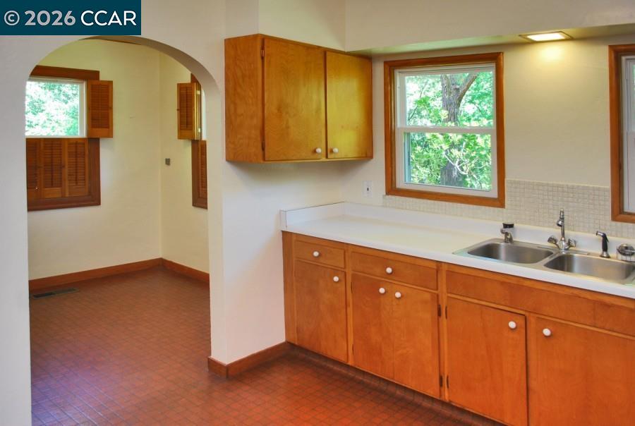 2652 Reliez Valley Road Martinez, CA 94553 - Photo 8 of 34 a kitchen with stainless steel appliances granite countertop a sink a cabinets and window