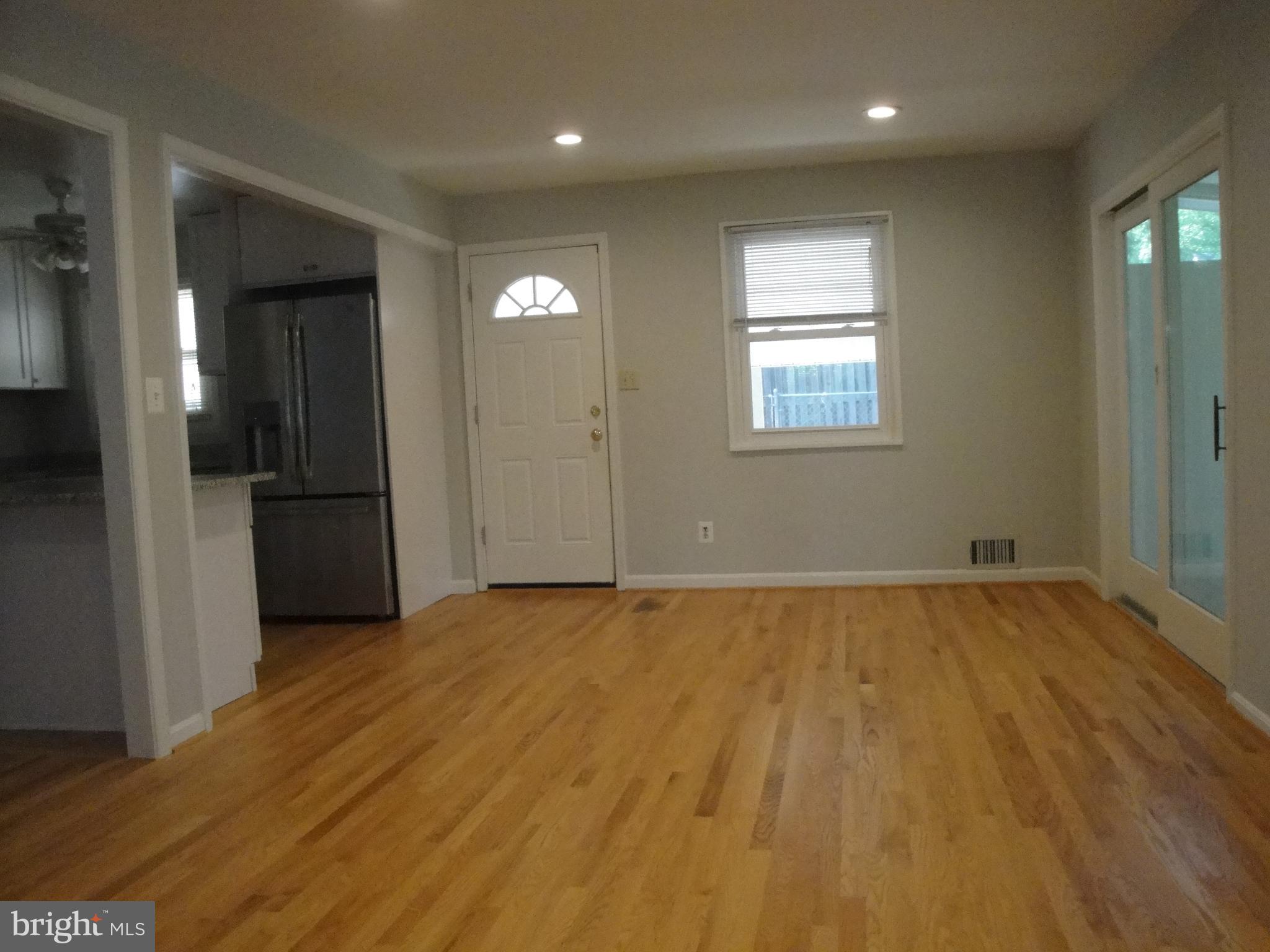 1825 Opalocka Drive McLean, VA 22101 - Photo 26 of 28 an empty room with wooden floor and windows
