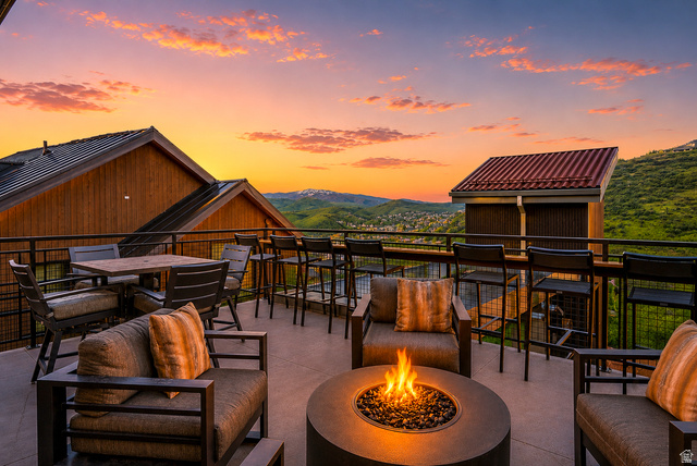 1258 Rothwell Road Park City, UT 84060 - Photo 40 of 48 Expansive outdoor patio featuring a built-in fire pit, multiple seating areas, and modern metal railings