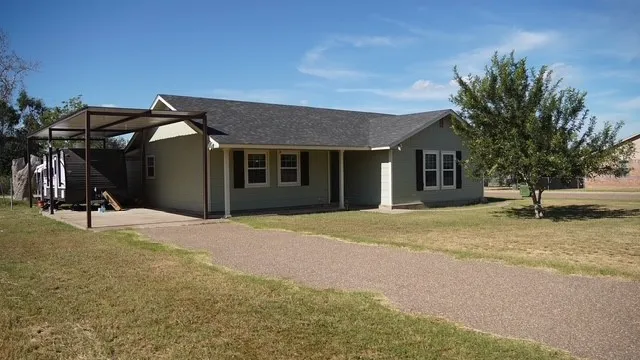 a view of a house with basketball court
