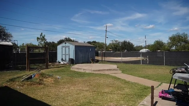 a swimming pool with some trees in the background