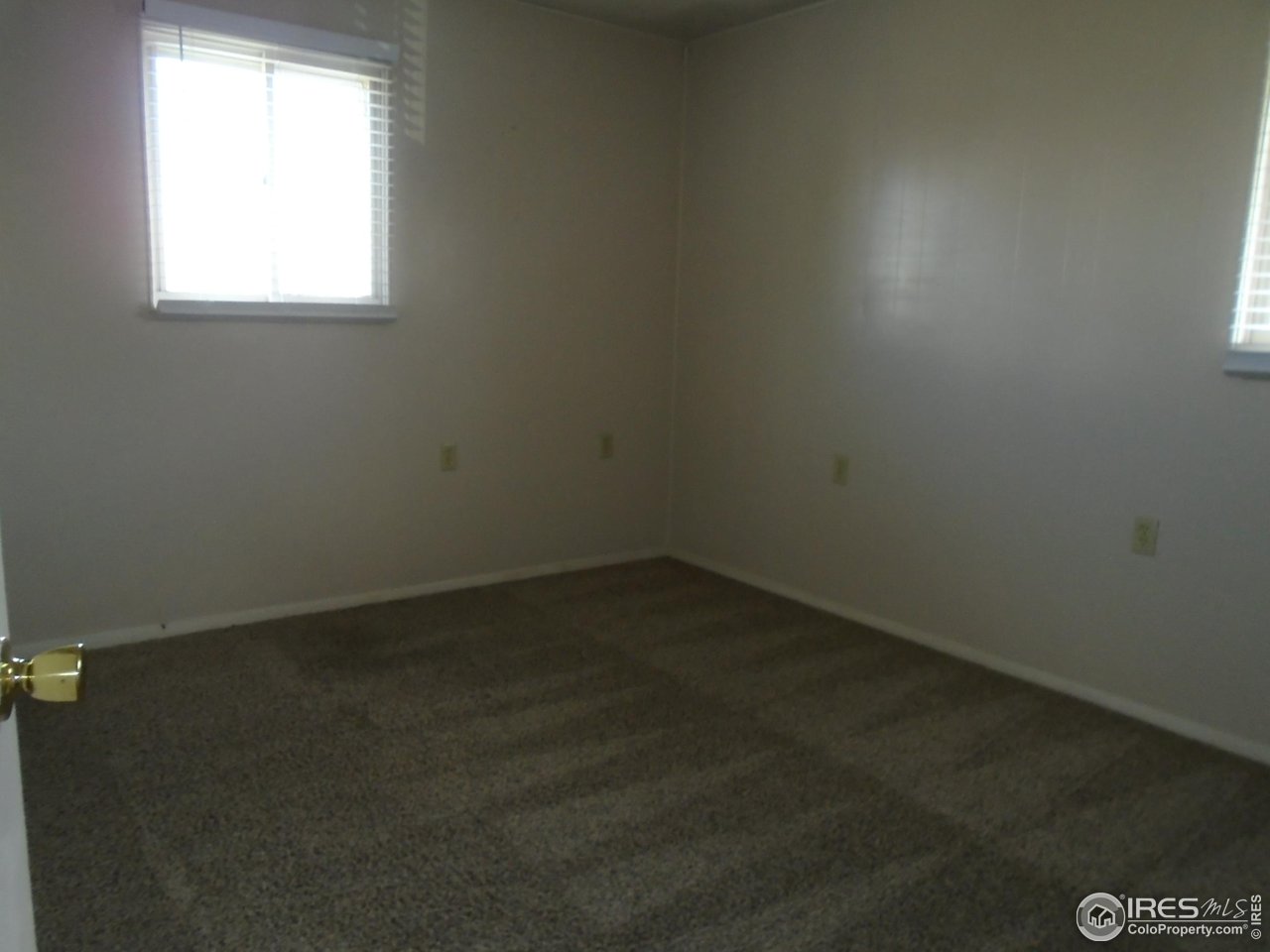 116 Walnut Street Windsor, CO 80550 - Photo 12 of 13 an empty room with a window