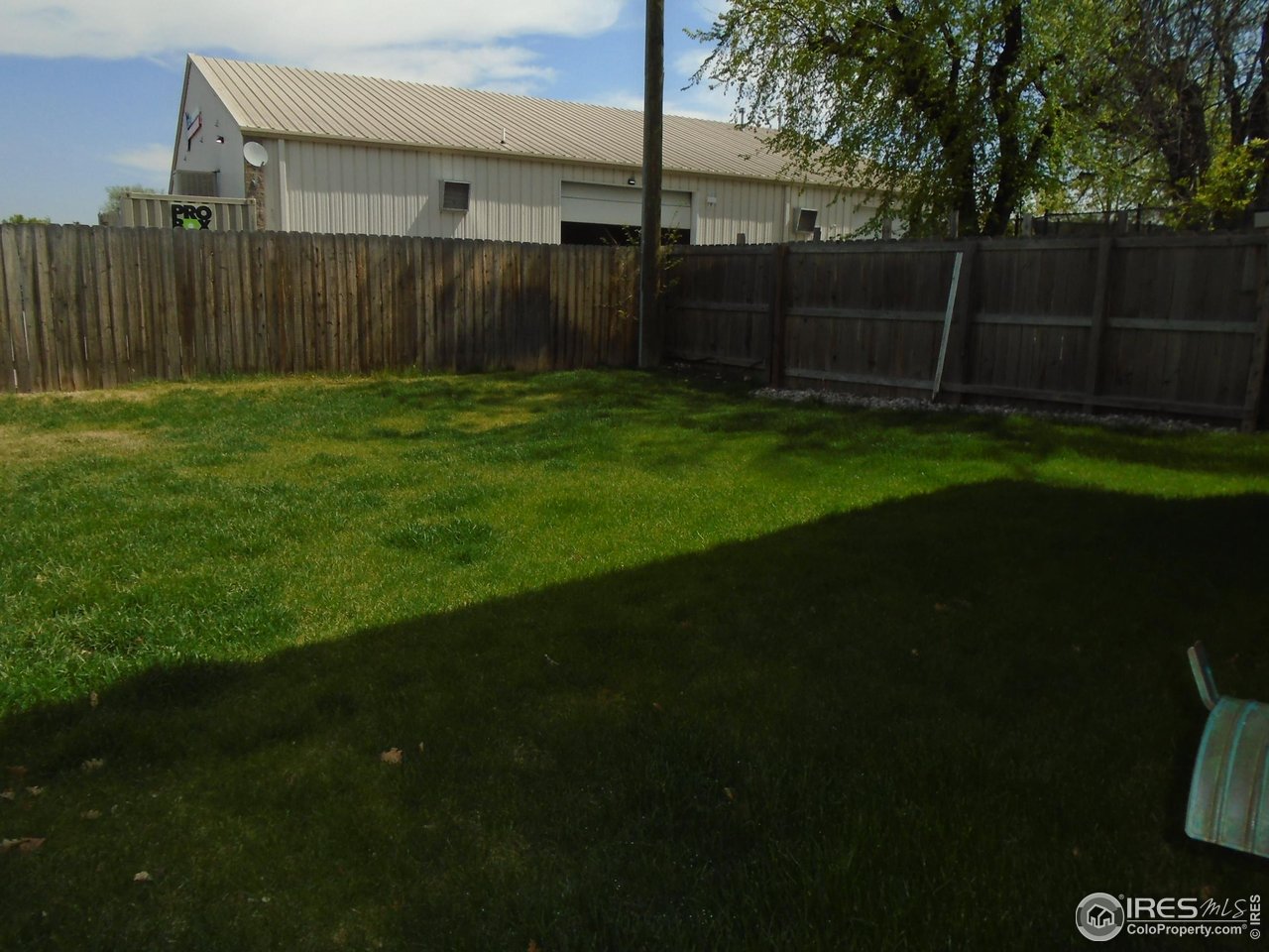 116 Walnut Street Windsor, CO 80550 - Photo 2 of 13 a view of a backyard