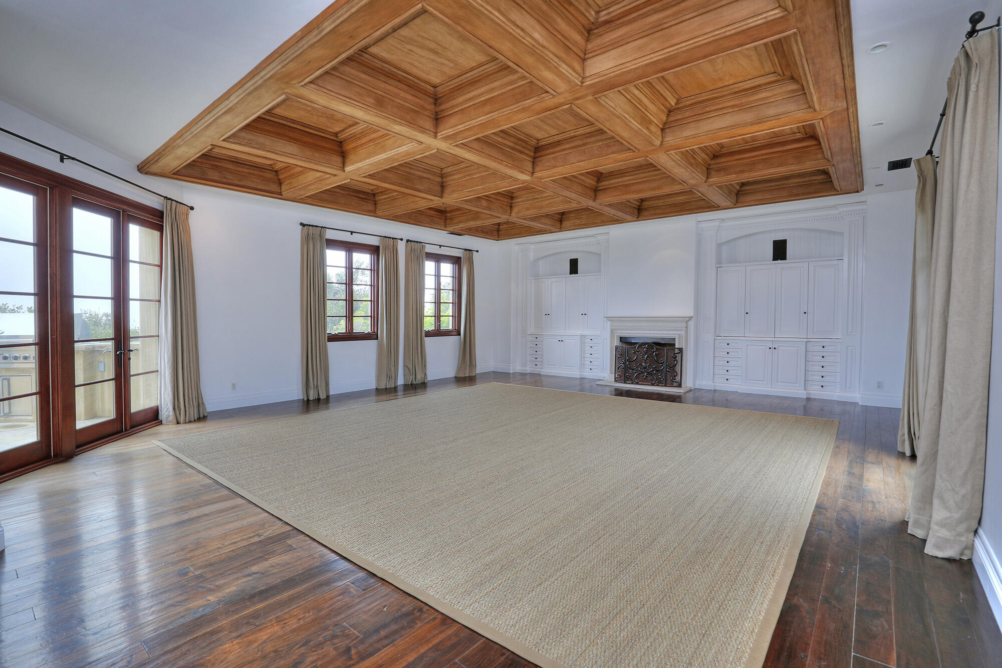 830 Park Lane Montecito, CA 93108 - Photo 22 of 40 a big room with wooden floor and windows