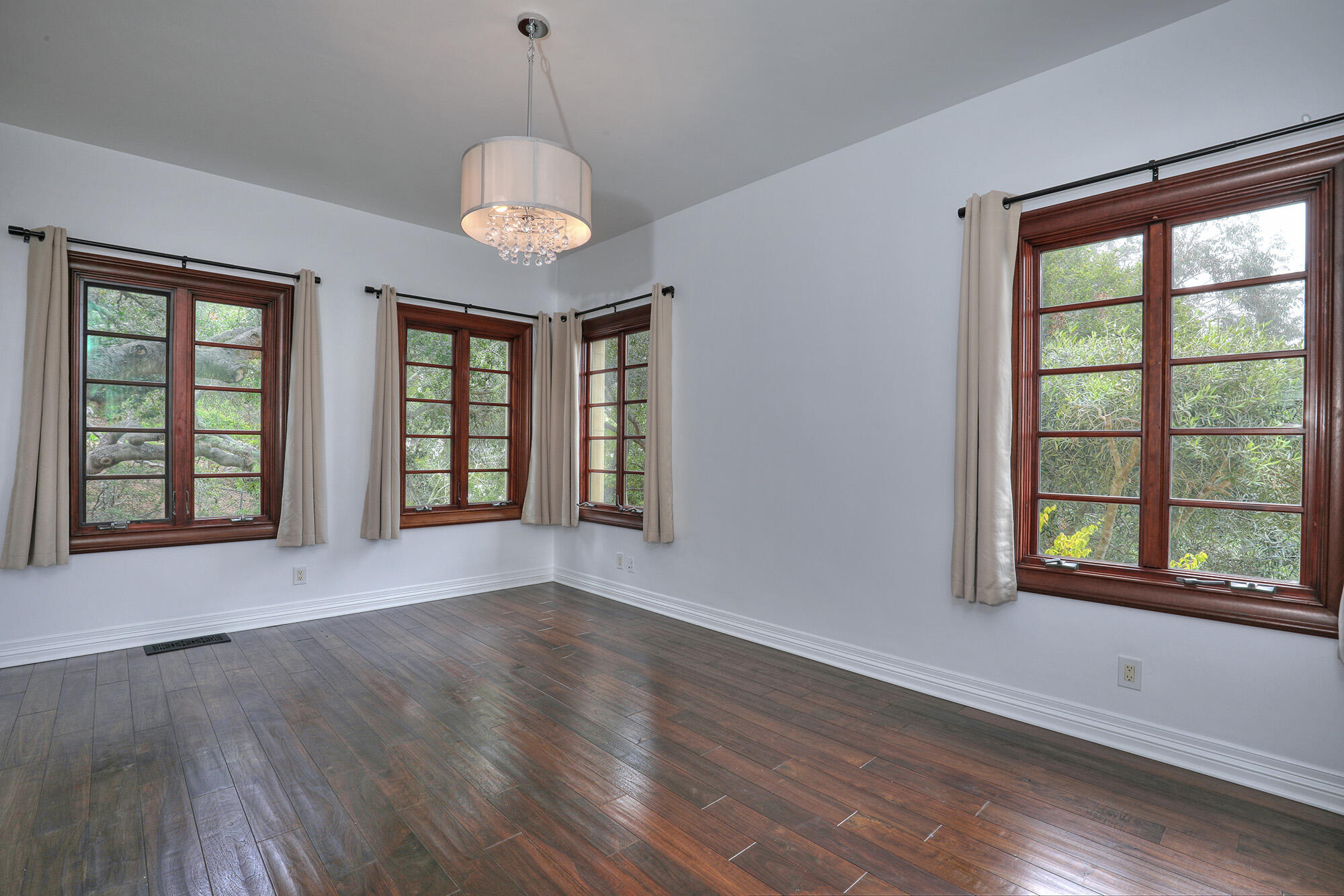 830 Park Lane Montecito, CA 93108 - Photo 27 of 40 a view of an empty room with wooden floor and a window