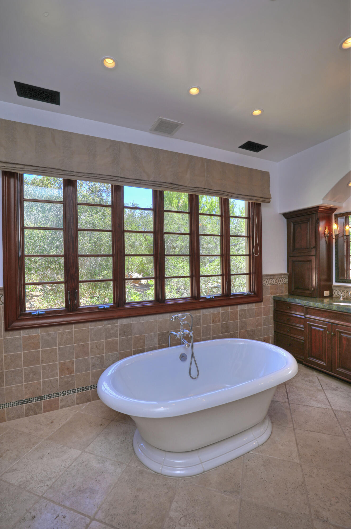 830 Park Lane Montecito, CA 93108 - Photo 28 of 40 a bathroom with a tub a sink and a large window