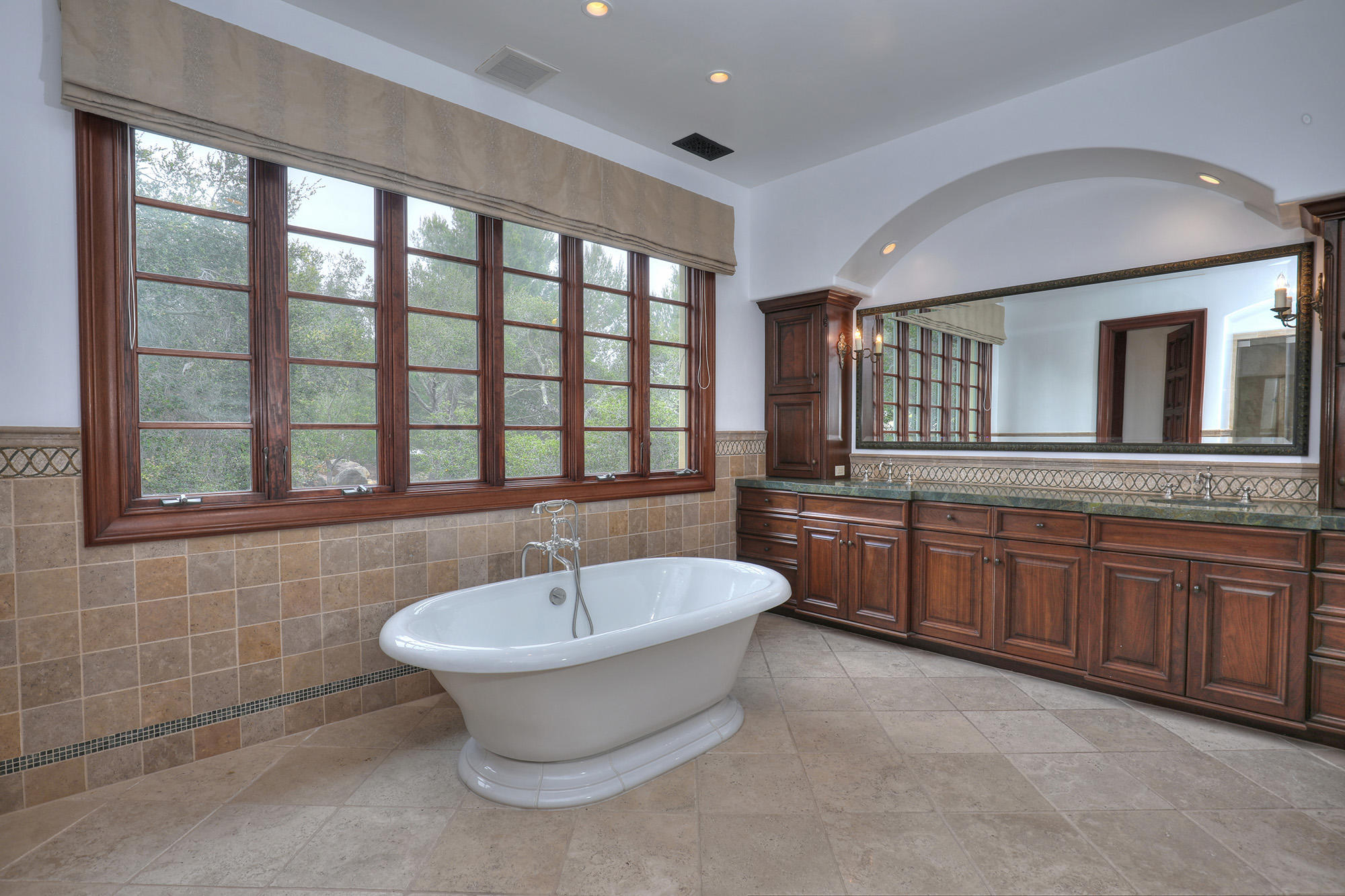 830 Park Lane Montecito, CA 93108 - Photo 29 of 40 a bathroom with a tub sink and mirror