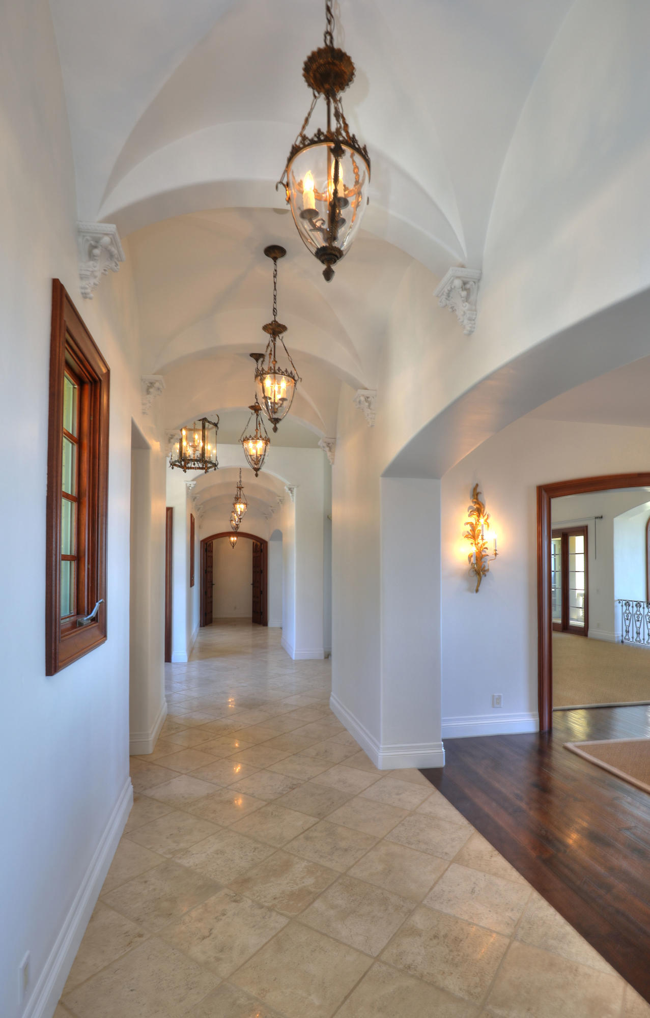 830 Park Lane Montecito, CA 93108 - Photo 7 of 40 a view of a hallway with a chandelier and chandelier