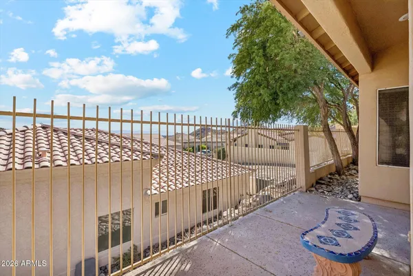 a view of a balcony with wooden fence