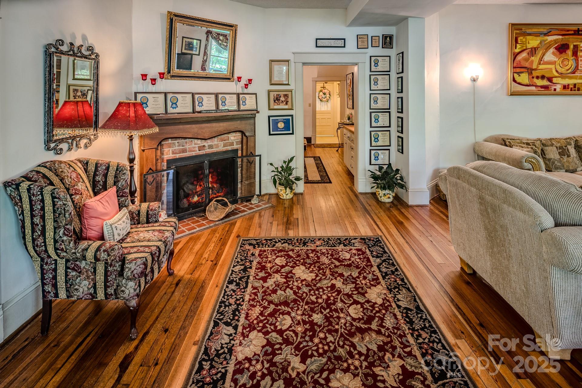 4584 Highway 194 Sugar Grove, NC 28679 - Photo 12 of 48 a living room with furniture fireplace and a flat screen tv