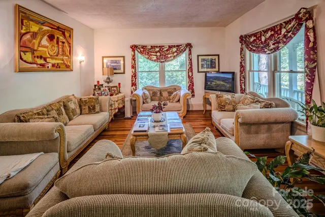 a kitchen with granite countertop a table chairs stove and cabinets