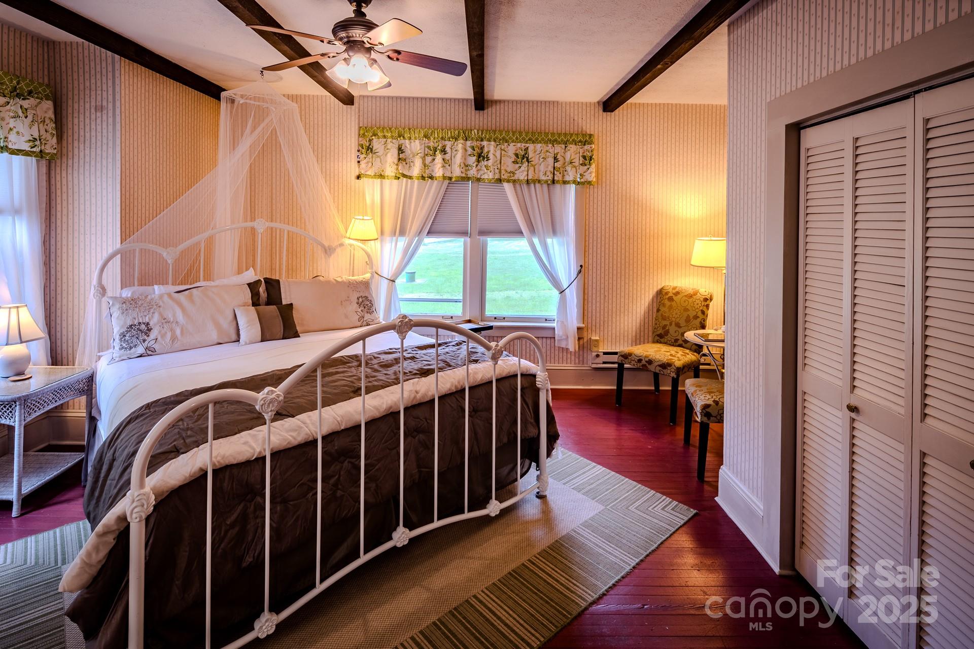 4584 Highway 194 Sugar Grove, NC 28679 - Photo 22 of 48 a bedroom with a bed next to a window