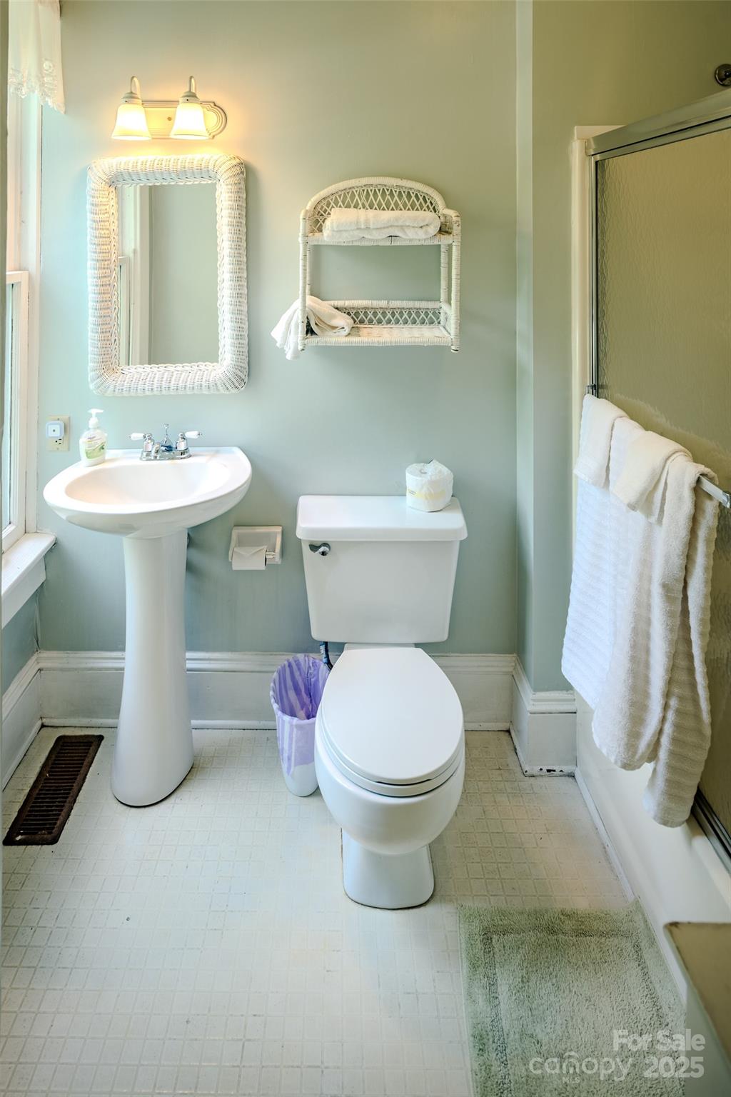 4584 Highway 194 Sugar Grove, NC 28679 - Photo 29 of 48 a bathroom with a sink toilet and mirror