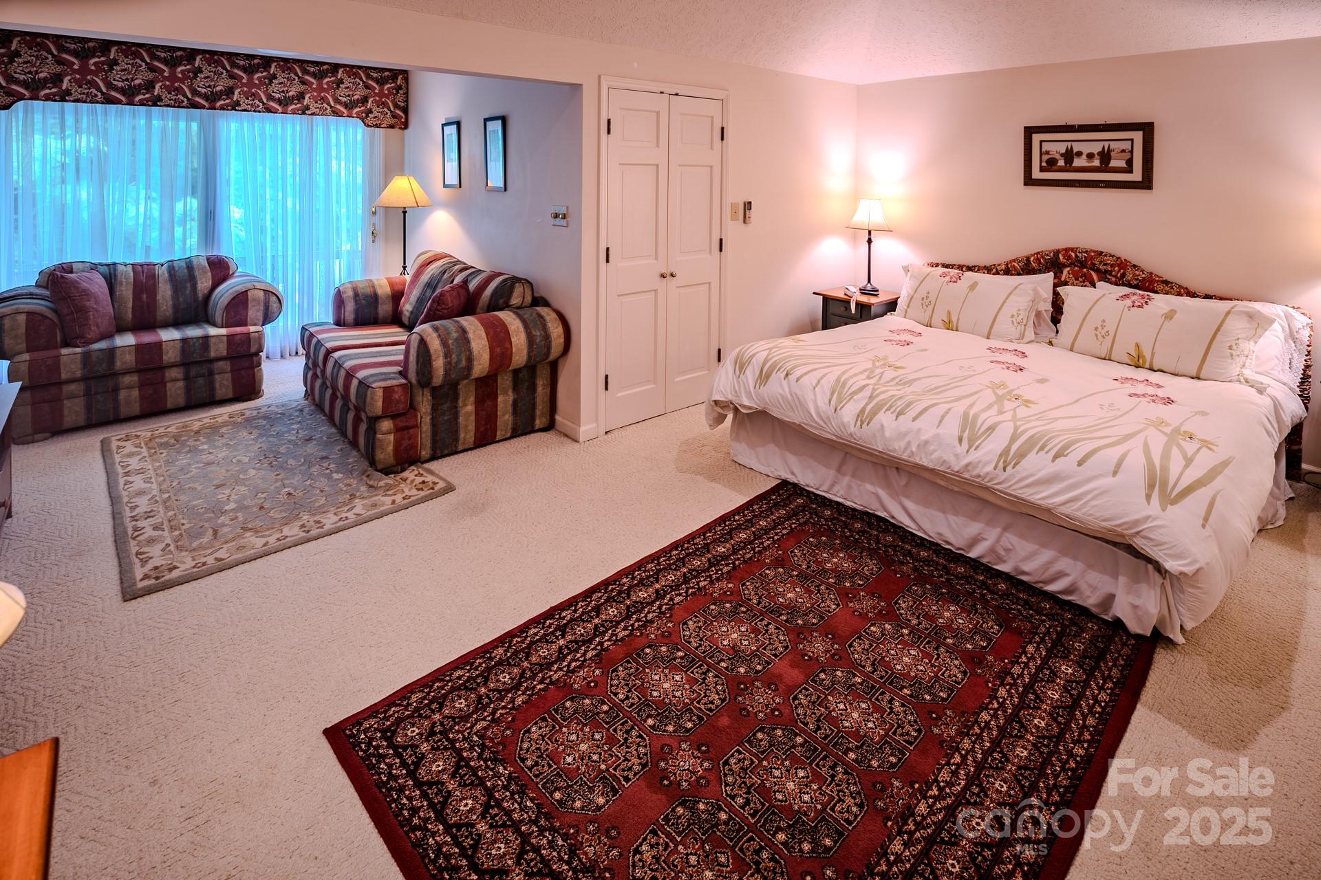 4584 Highway 194 Sugar Grove, NC 28679 - Photo 32 of 48 a bedroom with bed and a couch