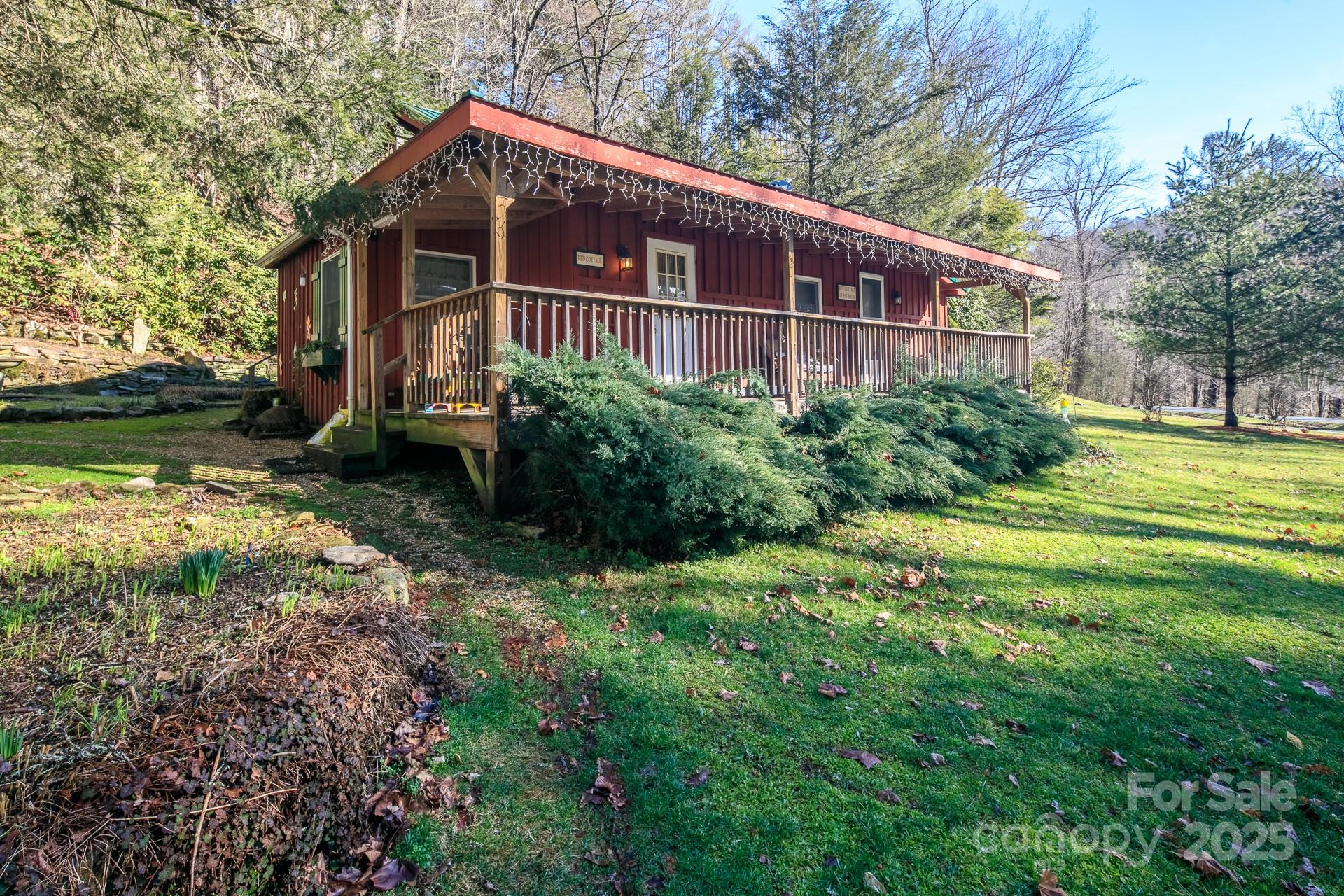 4584 Highway 194 Sugar Grove, NC 28679 - Photo 35 of 48 a front view of a house with garden