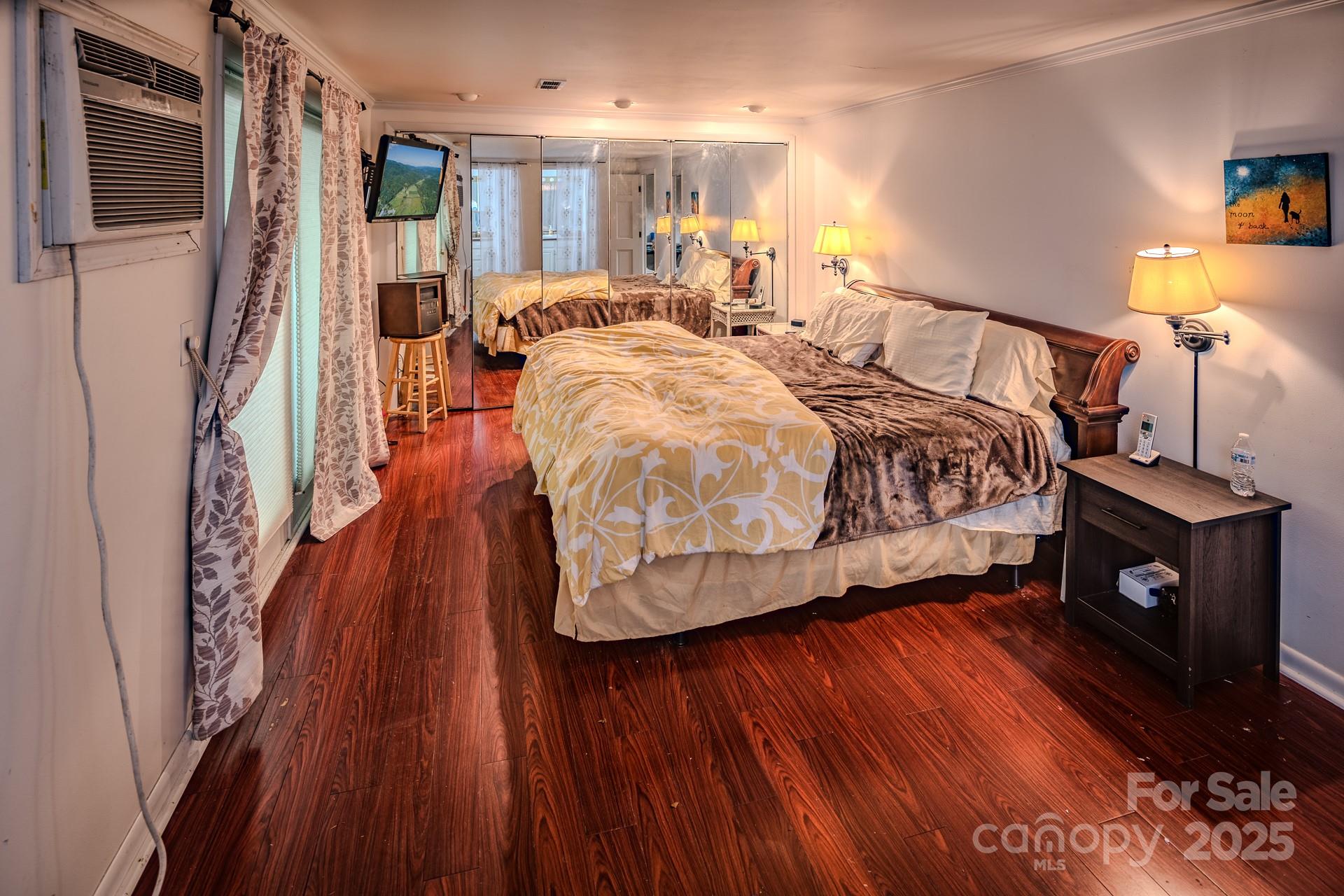 4584 Highway 194 Sugar Grove, NC 28679 - Photo 38 of 48 a bedroom with a bed and wooden floor