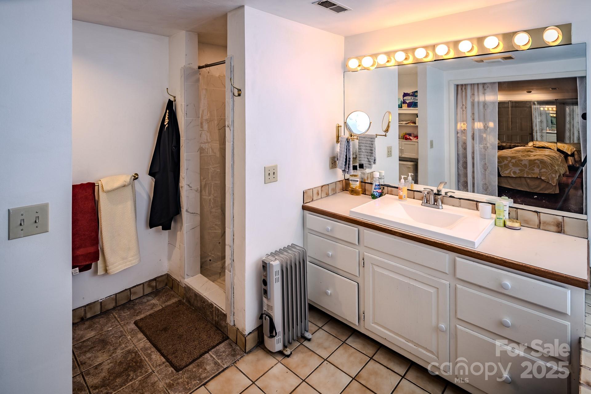 4584 Highway 194 Sugar Grove, NC 28679 - Photo 40 of 48 a bathroom with a sink and a mirror