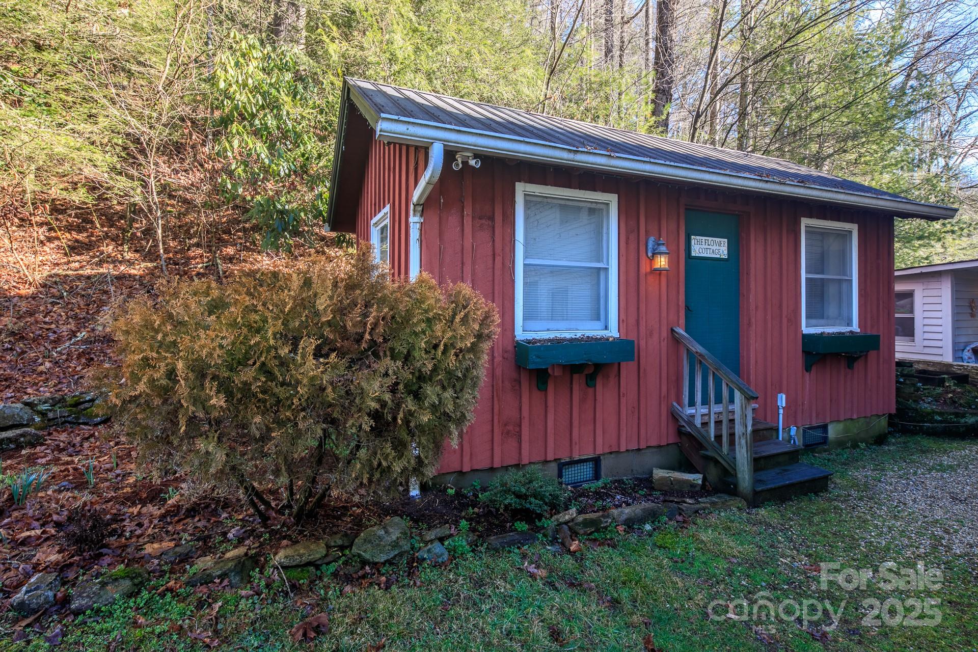 4584 Highway 194 Sugar Grove, NC 28679 - Photo 44 of 48 a front view of a house with garden