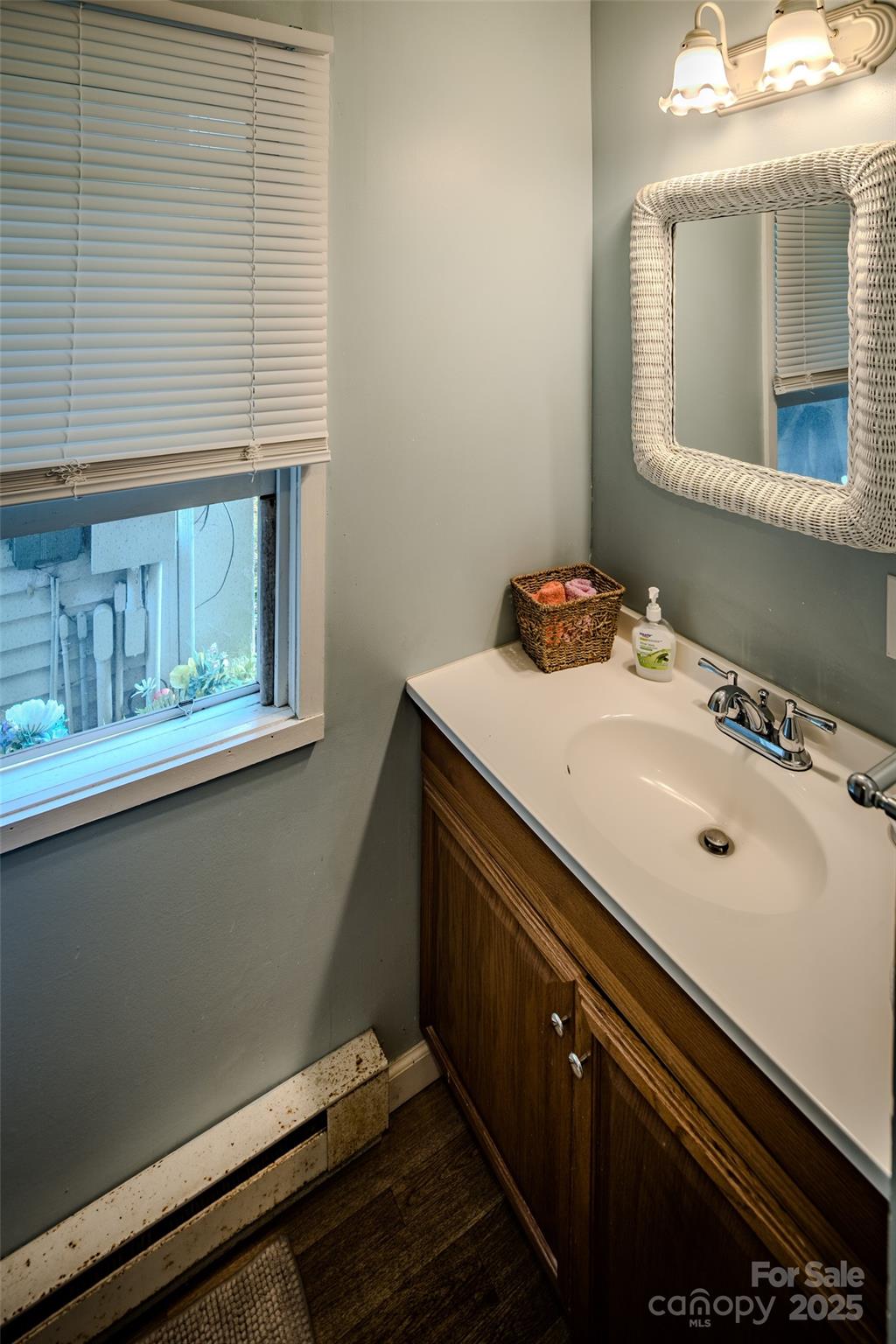 4584 Highway 194 Sugar Grove, NC 28679 - Photo 47 of 48 a bathroom with a sink and a mirror