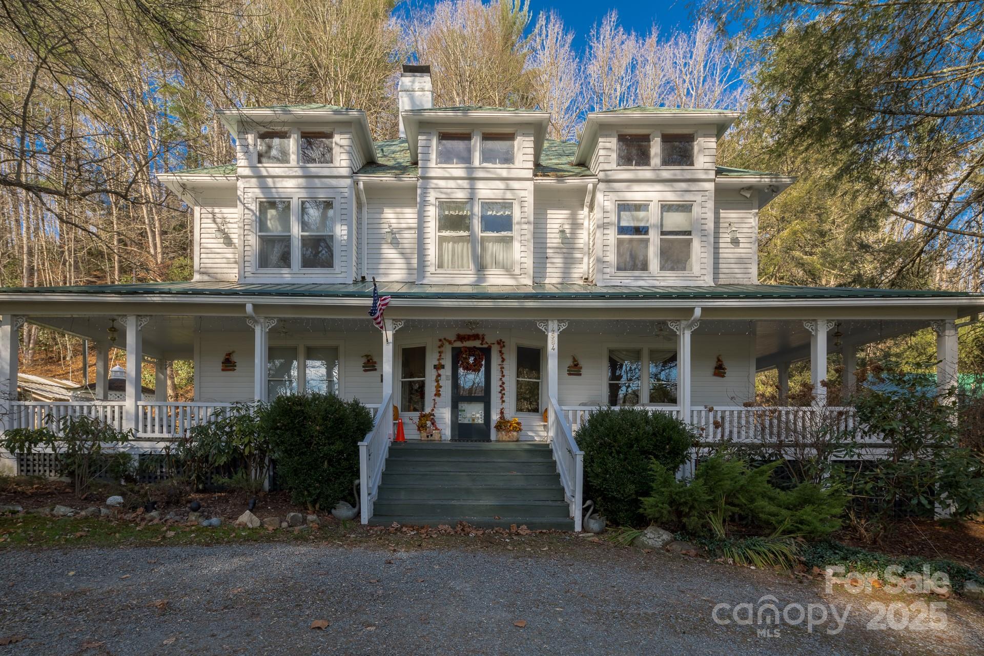 4584 Highway 194 Sugar Grove, NC 28679 - Photo 6 of 48 a front view of a residential apartment building with a yard