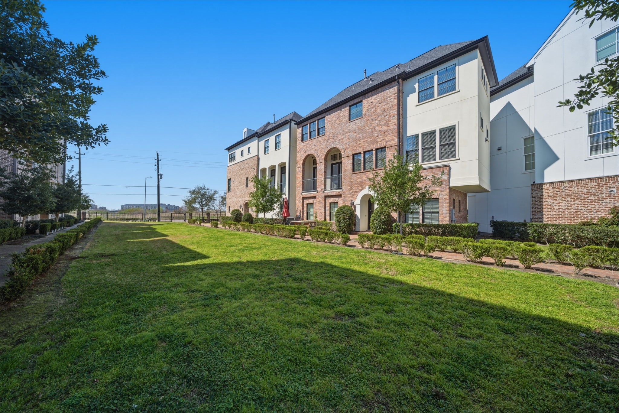 9452 London Bridge Station Houston, TX 77045 - Photo 32 of 38 This home is open to a shared courtyard/green space which floods the home with natural light