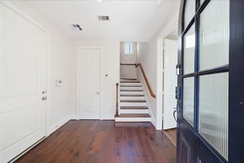 a view of entryway with wooden floor