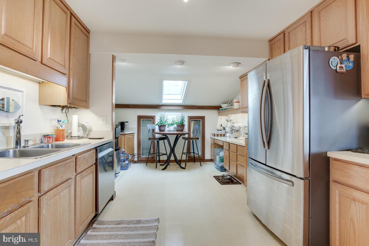 2546 Aster Road Port Republic, MD 20676 - Photo 31 of 54 a kitchen with a refrigerator a sink and dishwasher