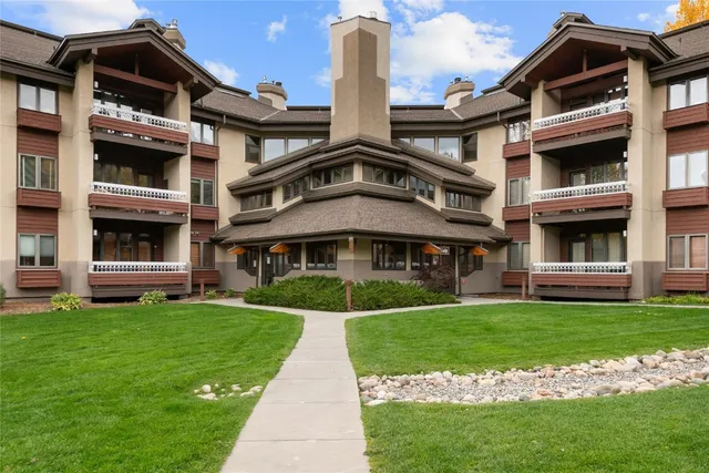 a front view of building with yard