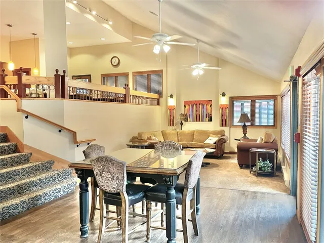 a view of a dining area with furniture and a kitchen
