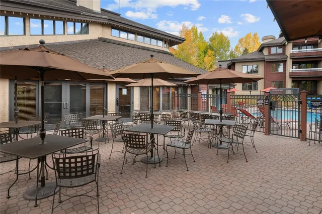 a view of a cafe with a table and chairs