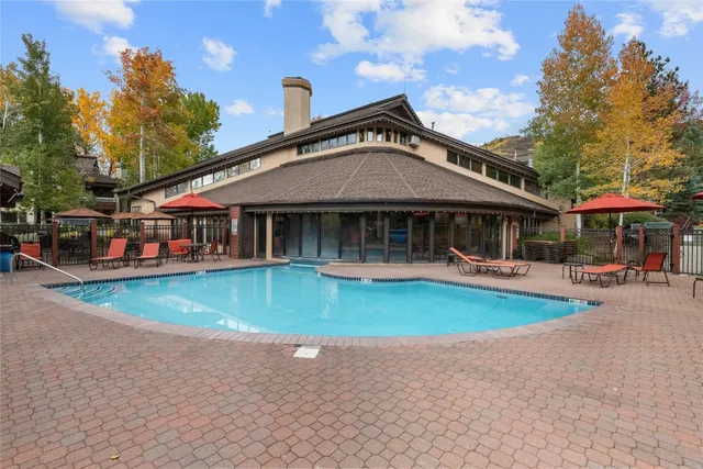 a front view of a house with a yard table and chairs