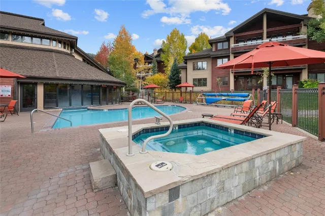 a view of a house with pool porch and chairs